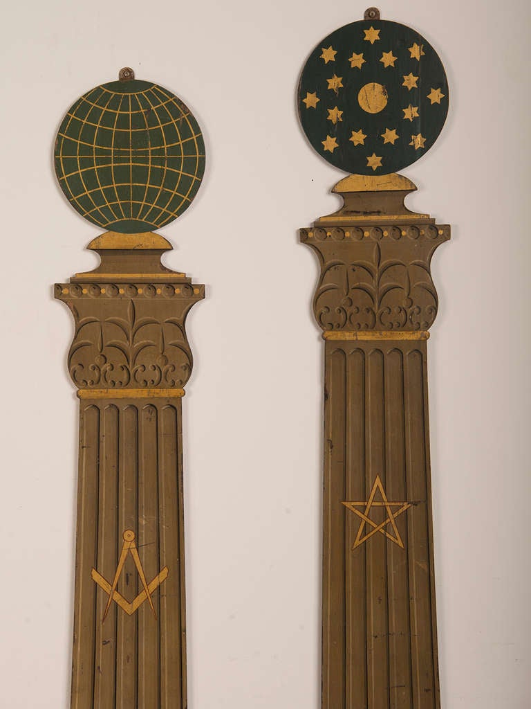Receive our new selections direct from 1stdibs by email each week. Please click Follow Dealer below and see them first! 

Pair of painted wooden plaques shaped like Classical columns each topped with a globe featuring symbols from the Order of