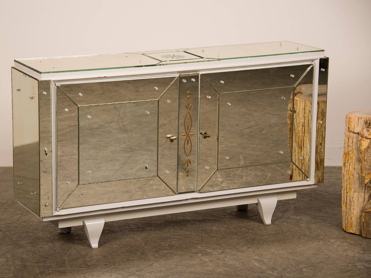 Receive our new selections direct from 1stdibs by email each week. Please click Follow Dealer below and see them first!

This exceptional cabinet buffet is notable for the original set of 20 individual mirrored panels that encase the wooden body.