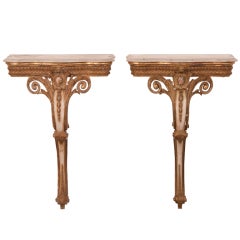 A pair of gilded and painted single leg console tables from Italy c.1880