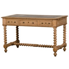 A pale oak Henri II style writing table from France c.1875