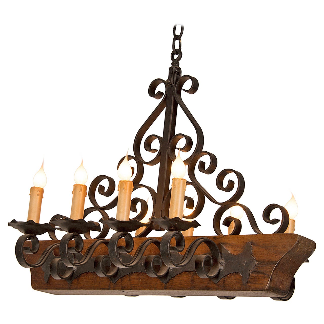 Decorative Chandelier with a Wooden Beam and Iron Candle Arms, France circa 1950 For Sale