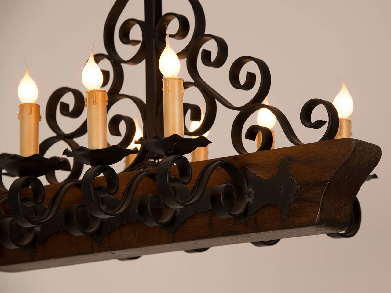 Decorative Chandelier with a Wooden Beam and Iron Candle Arms, France circa 1950 For Sale 1