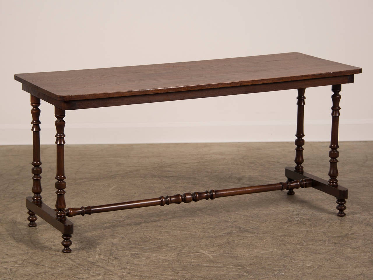 An elegant mahogany serving table or sofa table from England c. 1850 having a solid board of mahogany on the top. This detail is significant because it means the tree was of substantial size to afford a piece of timber of this scale. This top rests