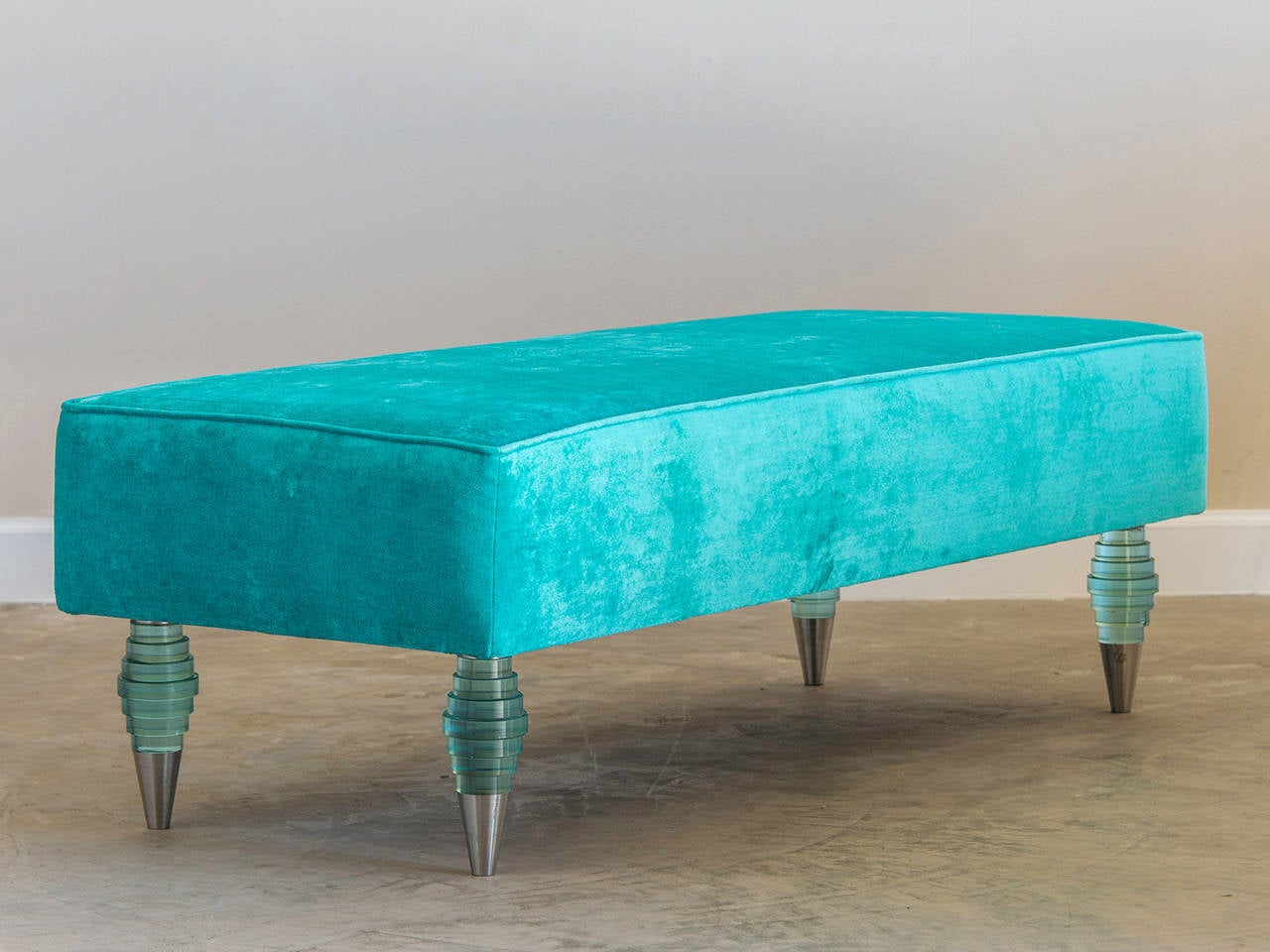 Glass leg bench, Italy, circa 1975. This unique bench features four legs made of stacked glass disks of varying diameters each retaining its original nickel mounts. The dramatic manner in which the glass legs capture and refract light because of the