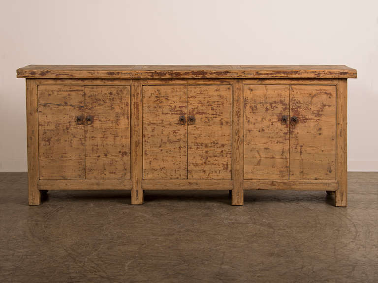 Painted enfilade/buffet, Kuang Hsu period, China c.1875. The handsome quality of the finish has been achieved by dry scraping the heavily painted surface to reveal the timber beneath. The simplicity of form is emphasized by the three pairs of