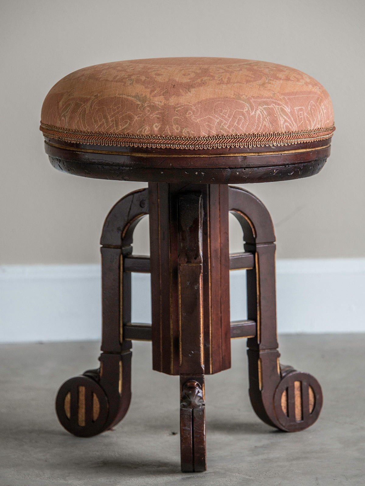 Art Deco Period Mahogany Gilded Stool, Vienna, Austria c.1930. The balanced and symmetrical appearance of this stool is enhanced by the use of a circular seat that echoes the circular feet that support the stool. Each leg and foot has the mahogany