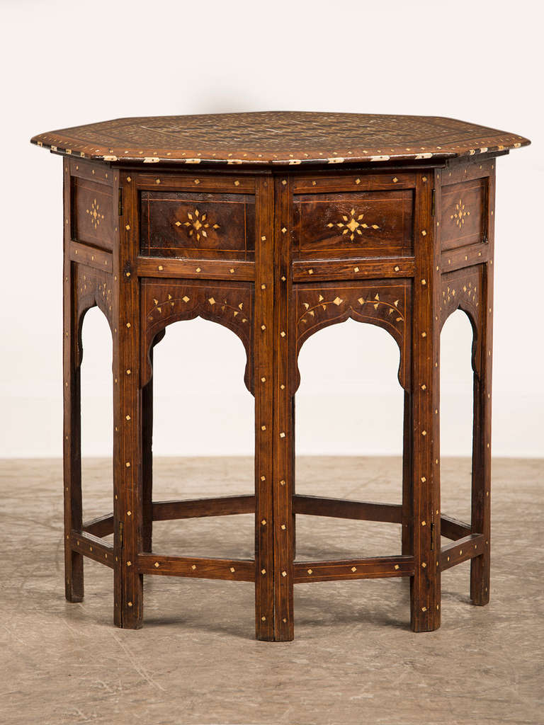 Large Camel Bone Inlaid Octagonal Walnut Table, Damascus, Syria, c.1900. This handsome table showcases the skill of artisans who for centuries have crafted intricate textiles as well as items of useful furniture. This table is not only a beautiful