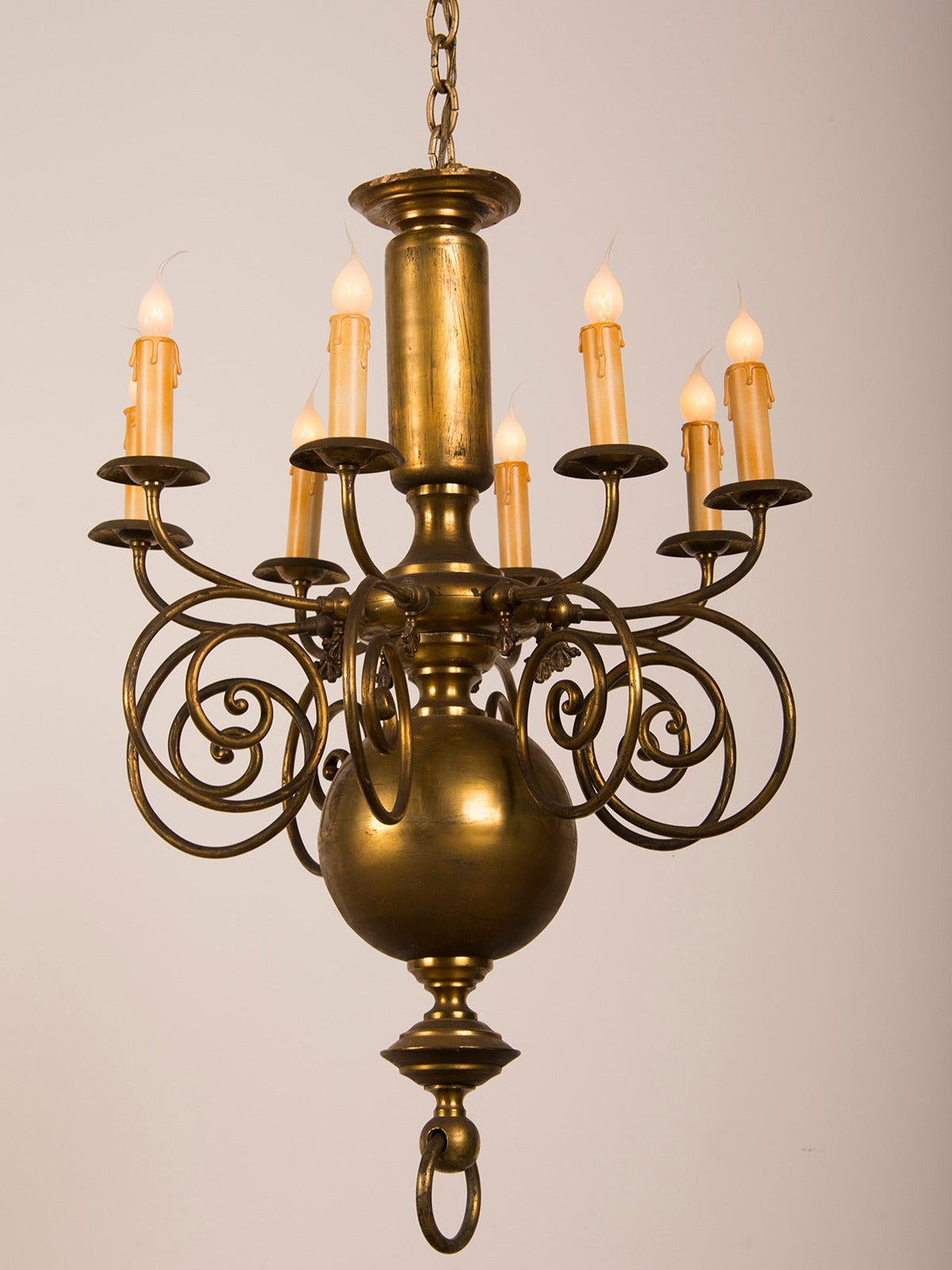 Receive our new selections direct from 1stdibs by email each week. Please click Follow Dealer below and see them first!

A tall and narrow antique Dutch brass chandelier circa 1900 having a substantial centre shaft with eight arms which scroll