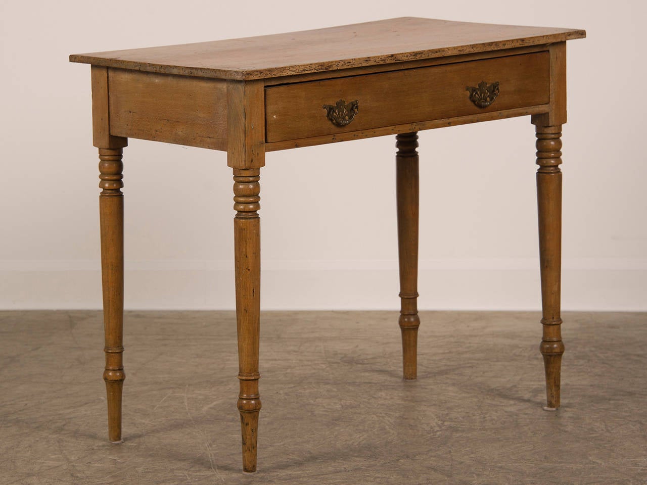 Receive our new selections direct from 1stdibs by email each week. Please click Follow Dealer below and see them first!

An antique English pine writing table circa 1875. This table shows the influence of mahogany furniture but translated into a