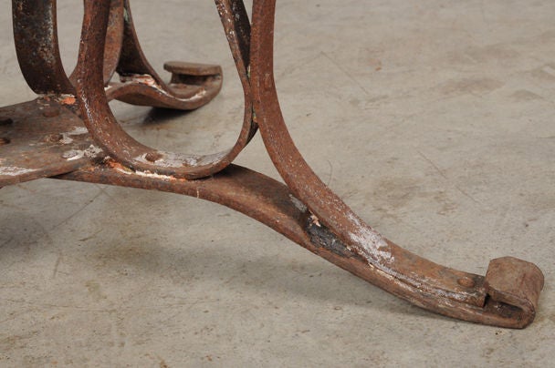 Iron base dining table with a marble top from France c. 1890 1