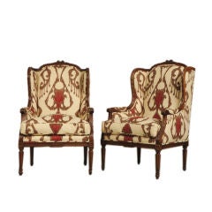 Pair of walnut Louis XVI style bergeres from France c. 1890