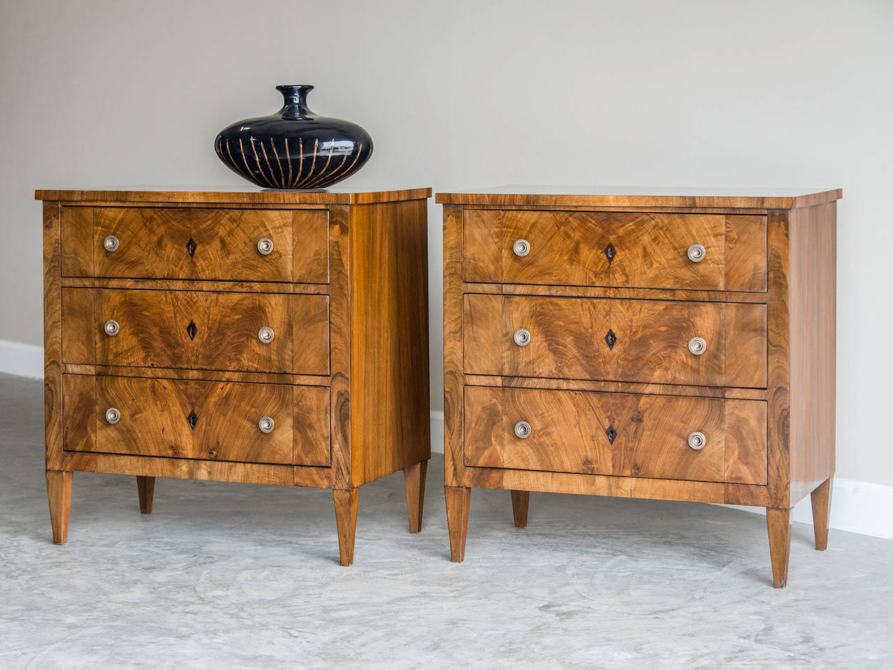 Pair of Biedermeier Style Matched Walnut Chests, Austria c. 1900. These handsome chests are notable for the exceptional quality of the matched walnut panels featured on both the tops and the entire front façade. The elegant simplicity of the