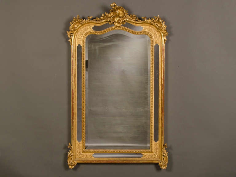 A superb Louis XV style gold leaf mirror with a cartouche from France c.1890