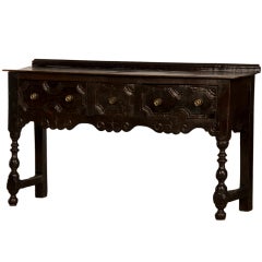 A gutsy Jacobean revival carved oak server table from England c.1840
