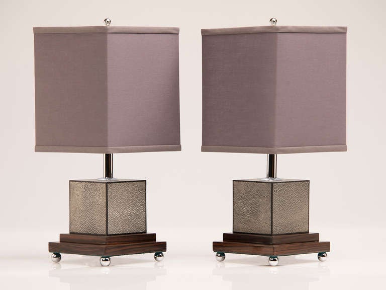 Art Deco Style Pair of Square Shagreen Lamps, Palisander Base, France c.1985. The double height square base of palisander wood (notable for its striking grain) is elevated on four circular chrome spheres while the custom square linen shades are each