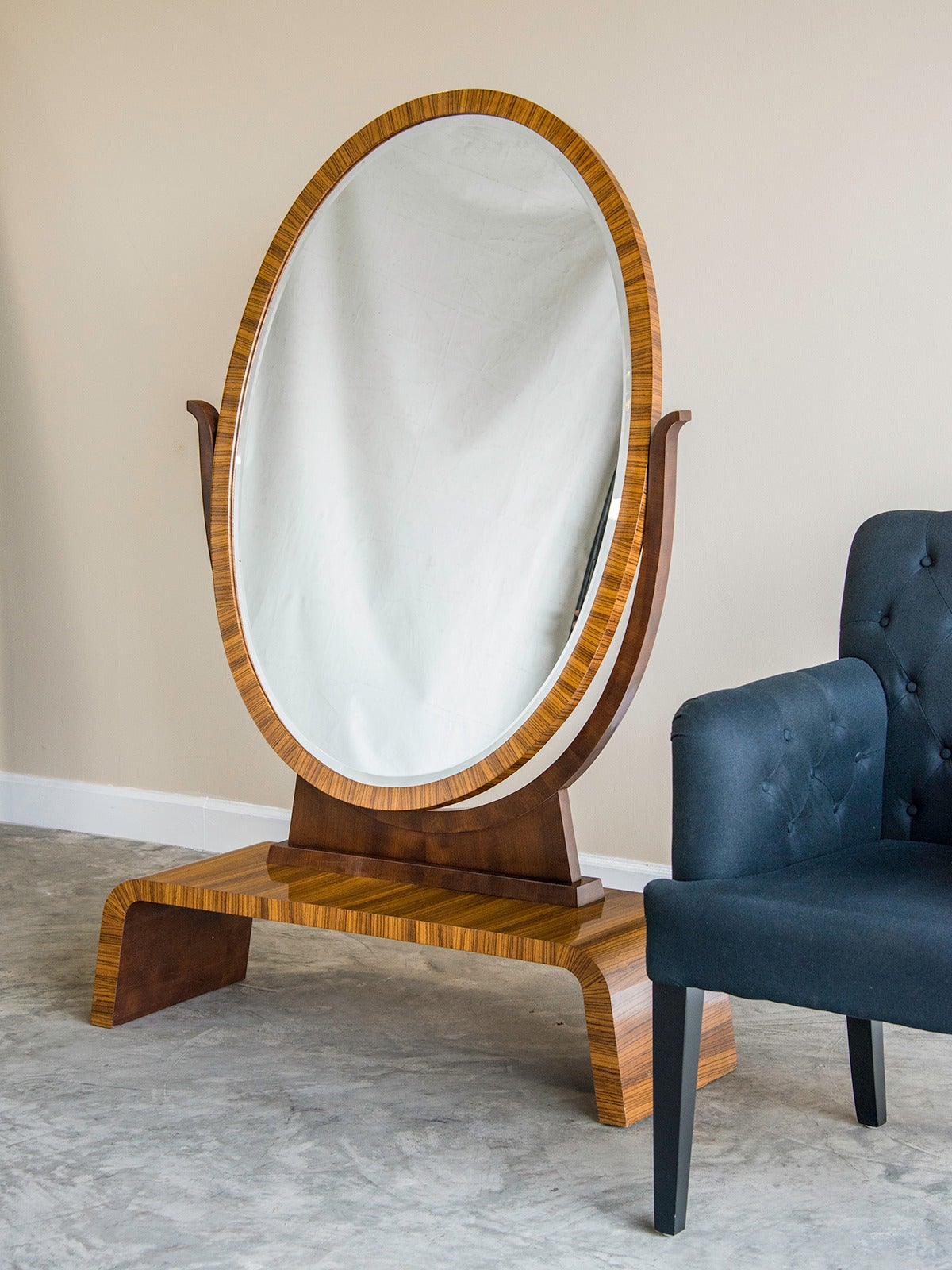 Art Deco period pale palisander oval dressing mirror, Vienna, Austria circa 1930. This full length mirror is a luxurious artifact of a glamorous period when dressing in an elegant fashion was an integral component of a well lived life. The elegant