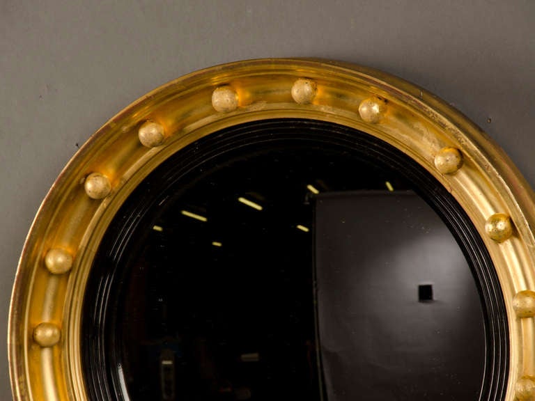Receive our new selections direct from 1stdibs by email each week. Please click Follow Dealer below and see them first!

An English Regency period gold leaf circular frame circa 1825 enclosing the original convex mirror glass. This type of round