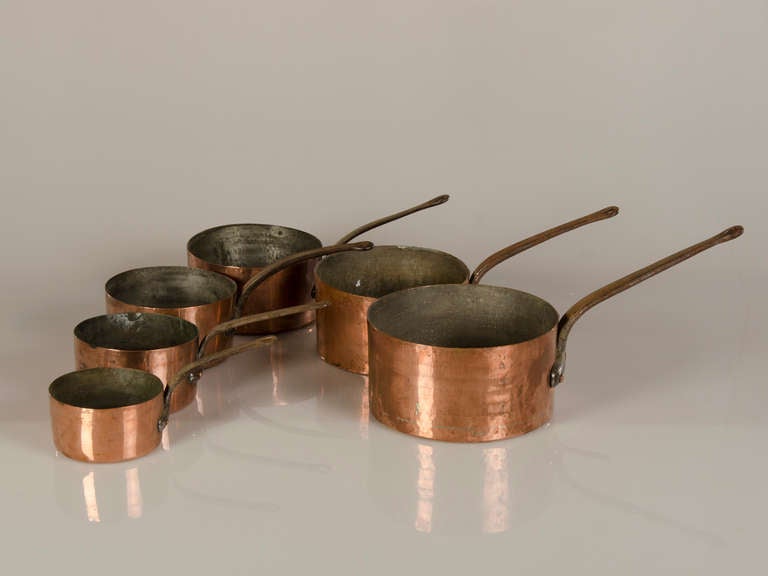 A matched set of six graduated sized copper sauce pans from the Louis Philippe period in France c.1830. This set is a rare survivor of close to two centuries of cooking duty. Most usually sets of valuable copper cookware are dispersed over the years