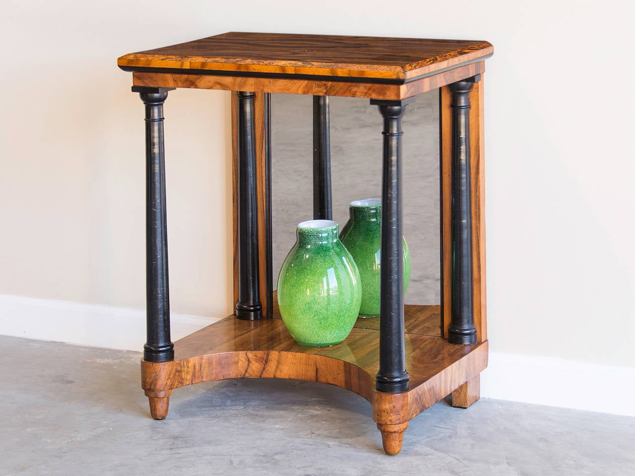 Receive our new selections direct from 1stdibs by email each week. Please click Follow Dealer below and see them first!

Antique Austrian Biedermeier period walnut console table circa 1825 with a mirrored back. The combination of dramatically
