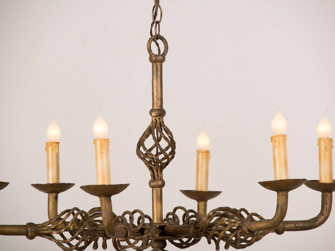 Receive our new selections direct from 1stdibs by email each week. Please click Follow Dealer below and see them first!

A unique gilded and forged iron six light vintage French chandelier circa 1930 with an open spiral twist design.