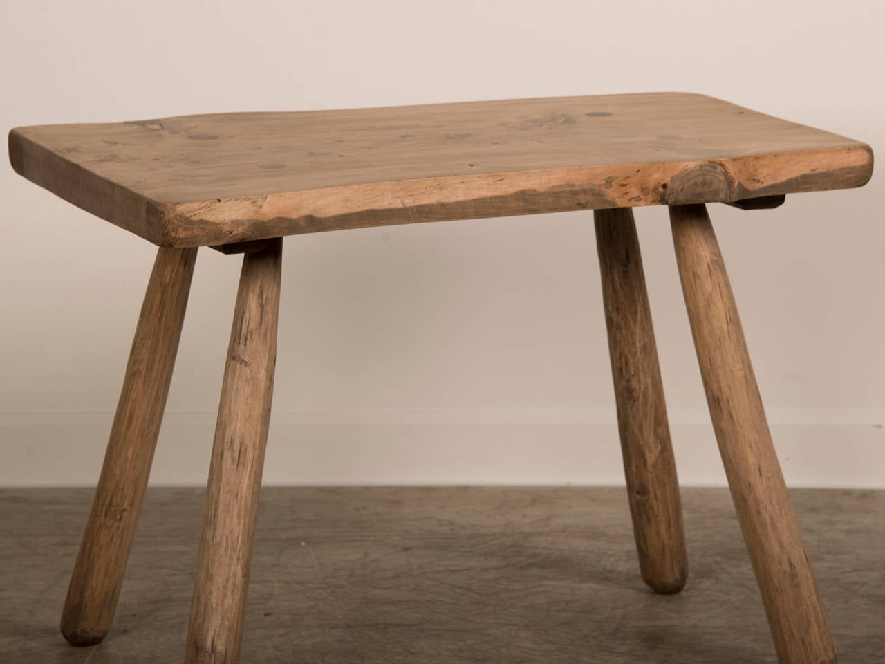 Hand Hewn Elm Side Table, France c.1820. The marvelous rustic quality of this table embodies a sculptural aesthetic while retaining an eminently functional capacity. Each of the individually shaped legs are set at an angle to the top to ensure