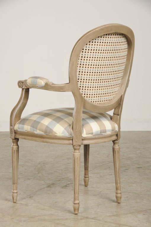 Wood A set of oval back Louis XVI style dining chairs from France