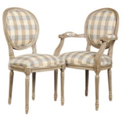 A set of oval back Louis XVI style dining chairs from France