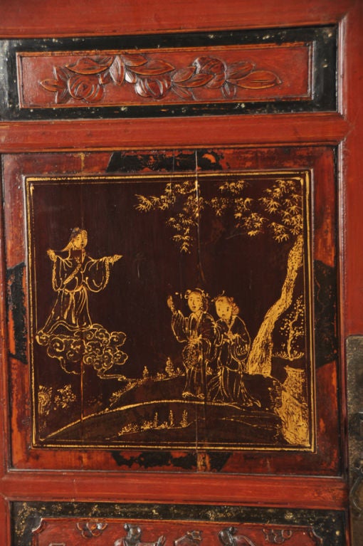 An attractive scholar's cabinet from the Kuang Hsu period in China c. 1875. Please notice this piece retains the original red lacquer colour over the entire piece as red was associated with good fortune. The cabinet is elevated on slender legs to