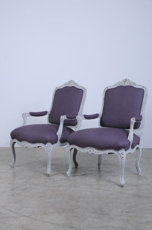 A pair of beautiful Louis XV style painted fauteuils (open armchairs) from France c. 1890. Please notice the classic form created during the reign of Louis XV (1723-1774) where every line is a soft curve that flows across all areas of each chair.