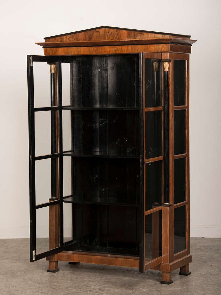 Austrian Empire style walnut vitrine having ebonized columns, Austria c.1890