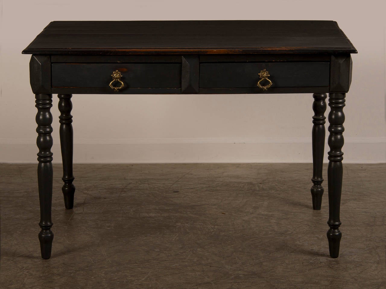 Receive our new selections direct from 1stdibs by email each week. Please click Follow Dealer below and see them first!

An antique French painted writing table circa 1900 with two drawers standing on turned legs. This handsome writing table has a