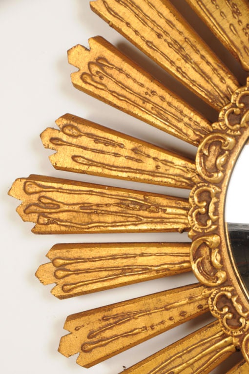 French Gilded wood sunburst mirror from France c. 1950