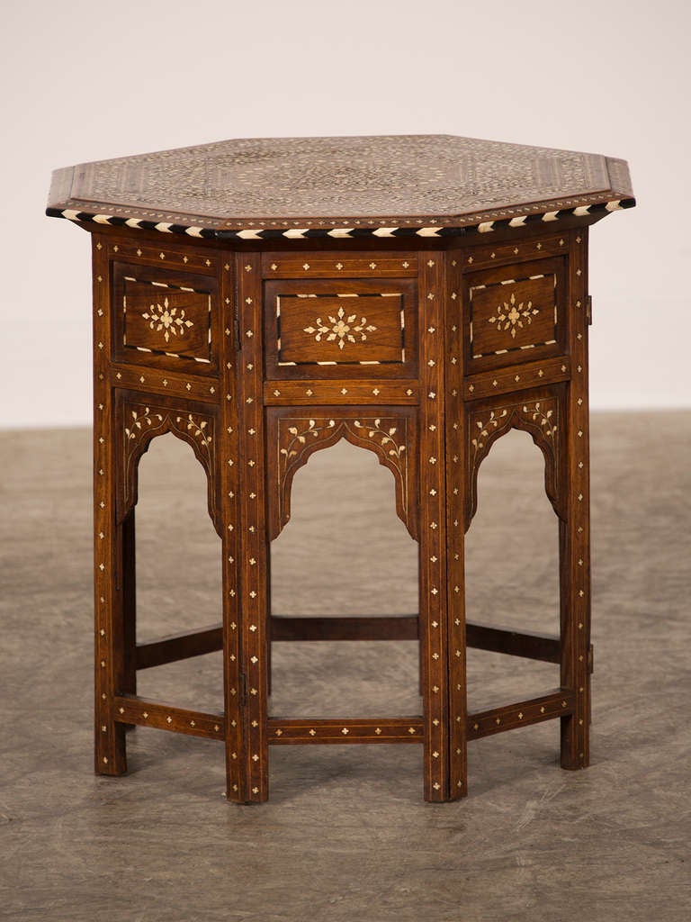 A stunning octagonal table inlaid with bone from Damascus, Syria c.1900. This table glistens in the light with its surface inlaid with a dazzling array of white bone that reinforces the eight sided shape. Even from a distance this table possesses a
