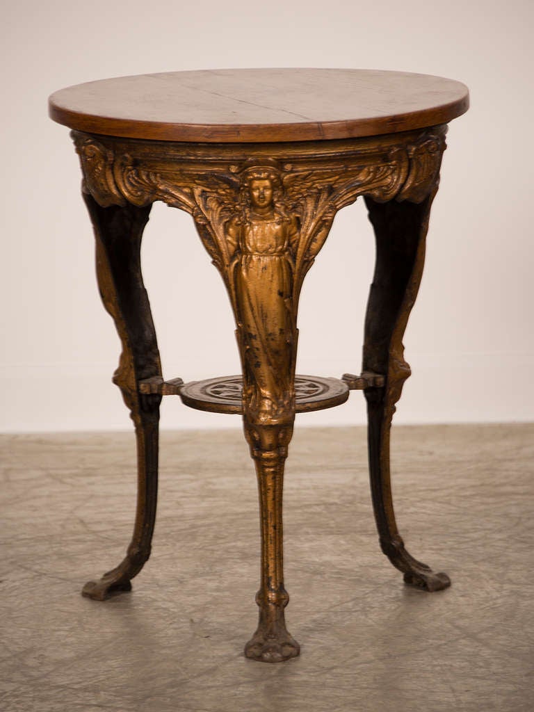 Receive our new selections direct from 1stdibs by email each week. Please click Follow Dealer below and see them first!

A French Belle Époque cast iron table with three legs and an oak top circa 1895. This table is an excellent example of late