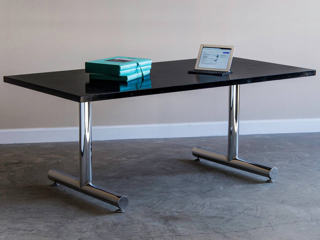Receive our new selections direct from 1stdibs by email each week. Please click Follow Dealer below and see them first!

Vintage American Milo Baughman chrome, ebonized oak table circa 1970. The simple rectangular top stands upon the iconic rolled