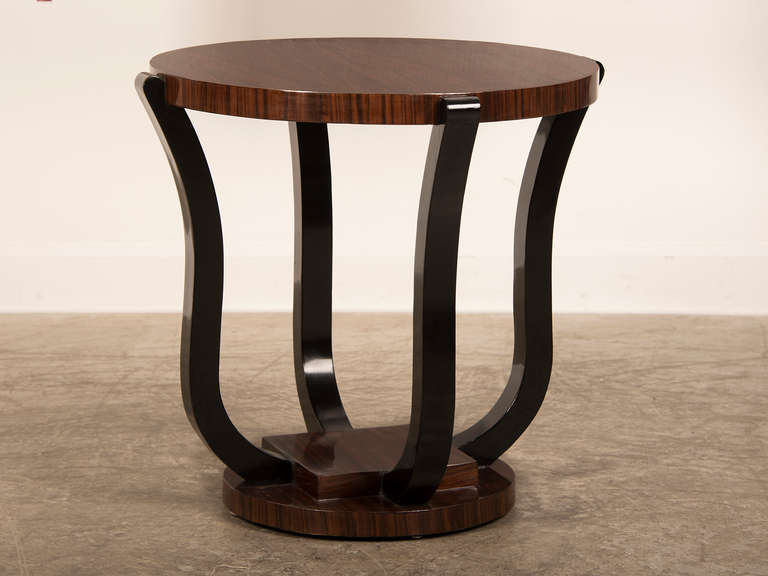 Art Deco Period Circular Palisander Wood Table, France c.1930. The combination of superbly grained timber visible in the palisander material as well as the strict architectural simplicity of the profile make this a striking table. The table has a