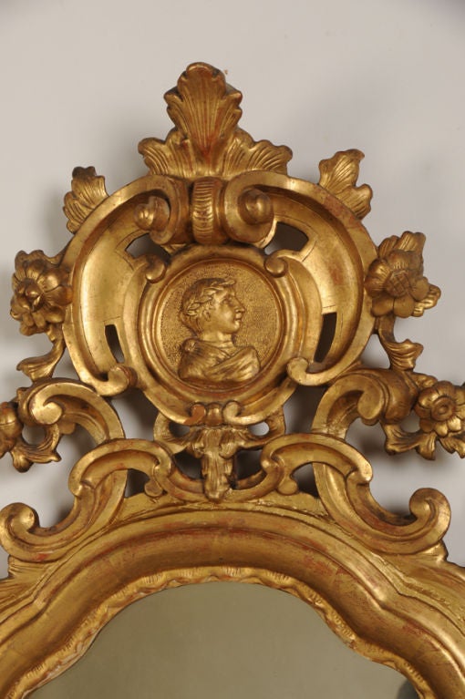 Receive our new selections direct from 1stdibs by email each week. Please click Follow Dealer below and see them first!

A lovely antique Italian neoclassical gold leaf frame enclosing the original engraved Venetian mirror glass, circa 1790. The