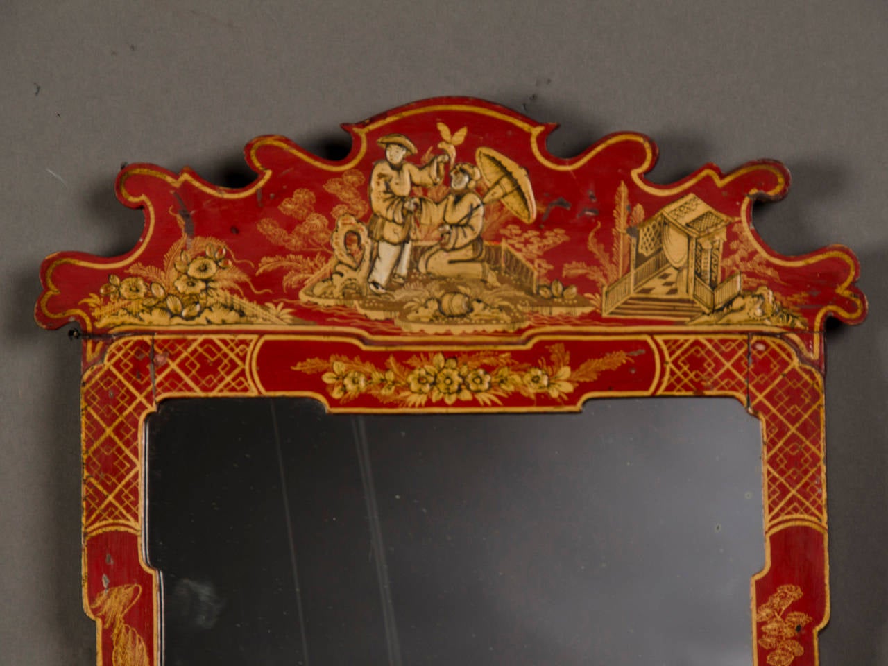 Receive our new selections direct from 1stdibs by email each week. Please click Follow Dealer below and see them first!

A slender antique English George II style scarlet coloured Chinoiserie decorated frame enclosing the original mirror glass