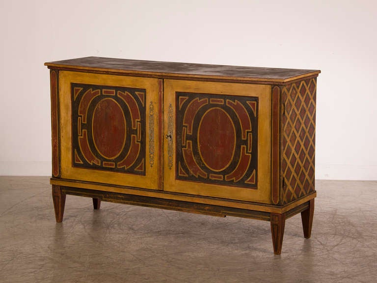 Receive our new selections direct from 1stdibs by email each week. Please click Follow Dealer below and see them first!

A pair of antique Italian Neoclassical two door buffet or credenza circa 1860 with an original hand painted design covering
