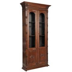 Slender and tall carved oak bibliotheque from France c. 1890
