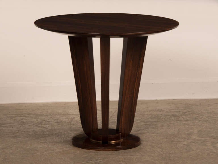 The combination of pared down decoration and the extreme beauty of the palisander timber give this table its visually striking appearance. Palisander wood is of the rosewood family and was especially prized by designers of the Art Deco period