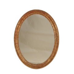 Elegant oval gold leaf frame mirror from France c. 1880