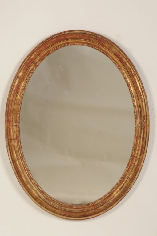 Elegant oval gold leaf frame mirror from France c. 1880
