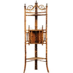 Antique Scorched bamboo corner cabinet from England c. 1890