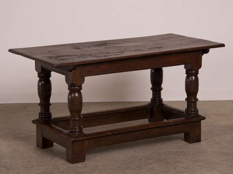 Receive our new selections direct from 1stdibs by email each week. Please click Follow Dealer below and see them first!

An antique English Jacobean style oak refectory table with robustly turned legs joined by a stretcher and a removable top