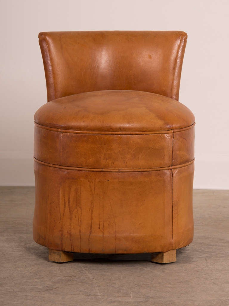 French Art Deco period round leather chair with a low back, France c.1930
