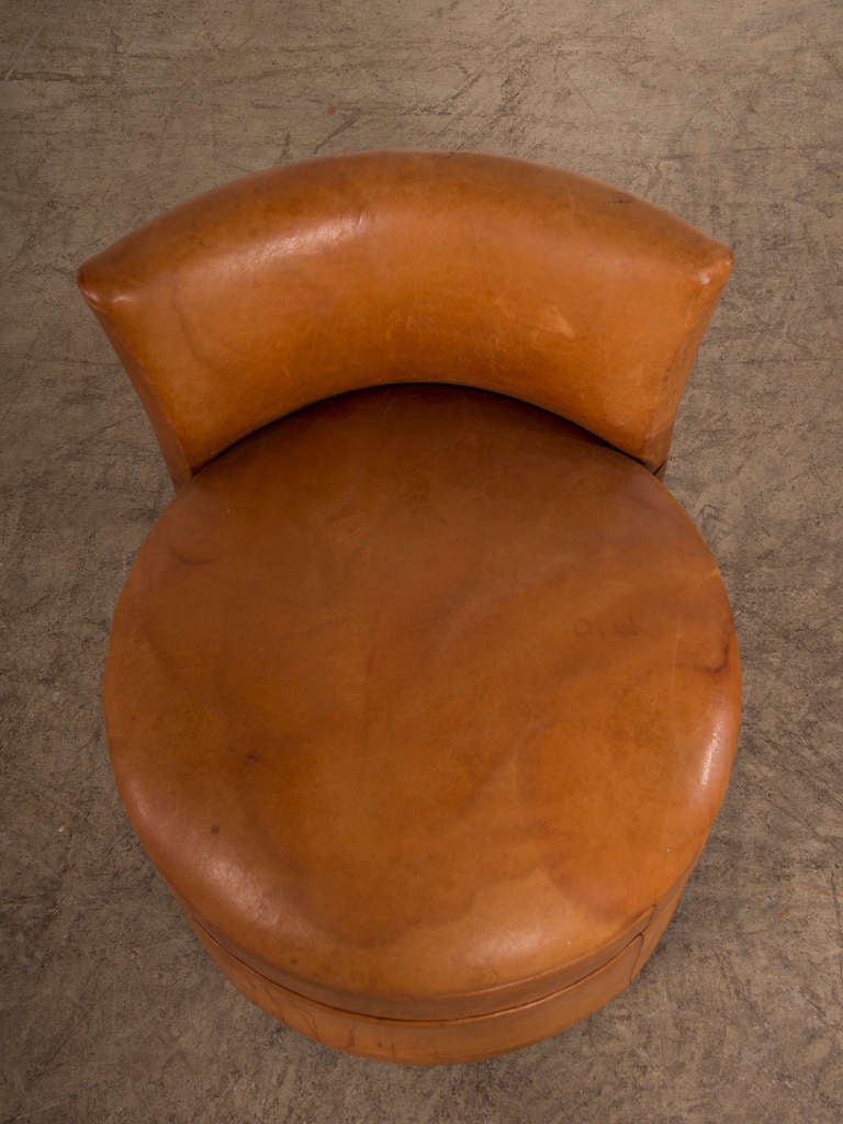Leather Art Deco period round leather chair with a low back, France c.1930