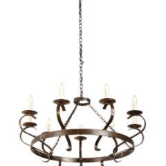 A pair of large iron chandeliers from France c. 1930