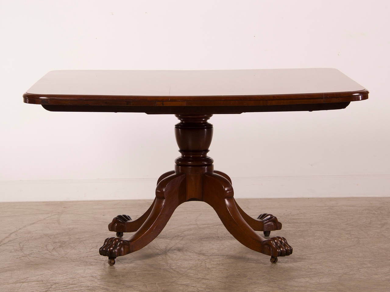 Receive our new selections direct from 1stdibs by email each week. Please click Follow Dealer below and see them first!

An antique English William IV period mahogany breakfast table circa 1835 having a square top supported by a central pedestal