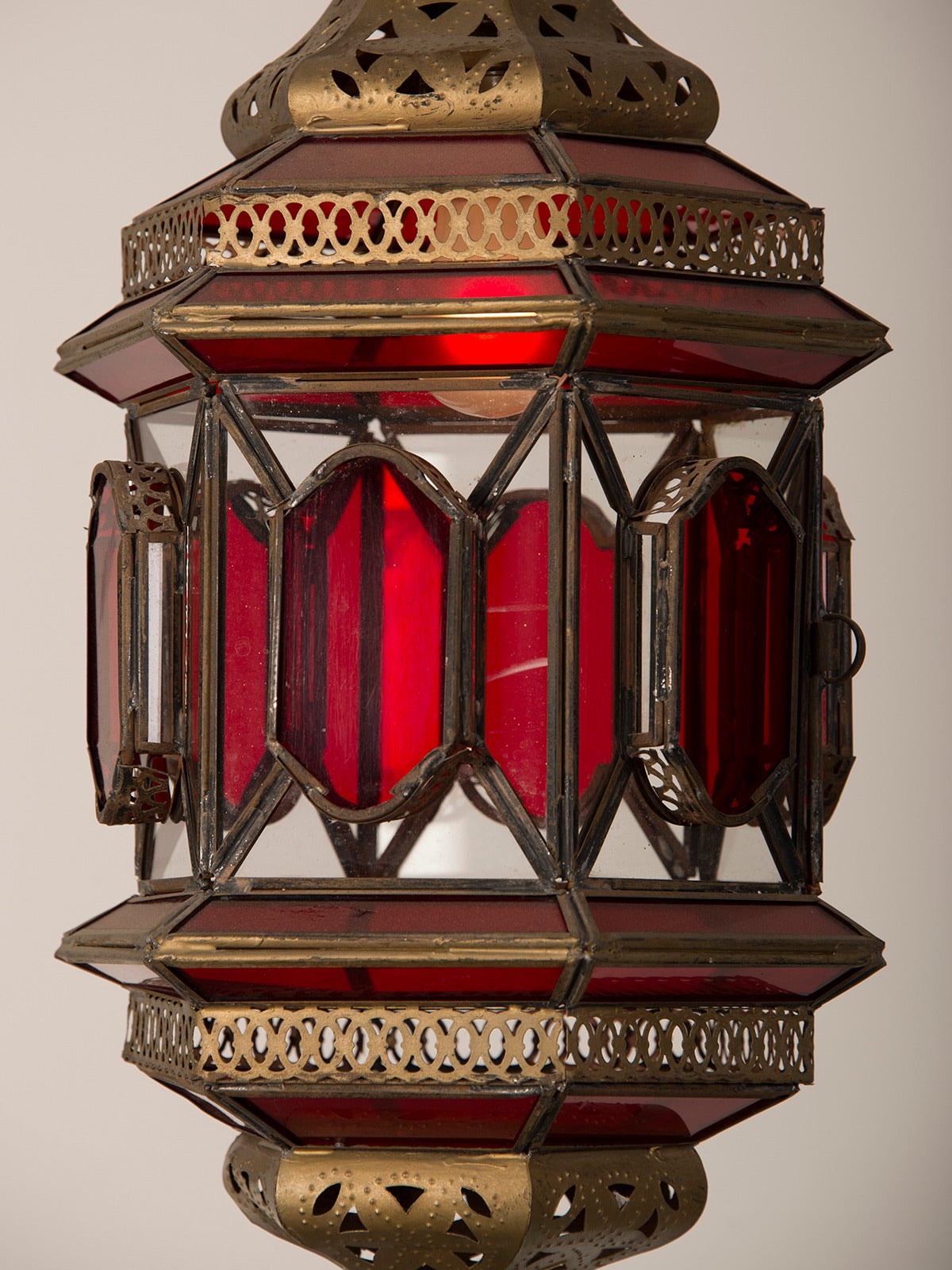 Moroccan Lantern circa 1940 Enclosing Ruby and Clear Glass with Filigreed Brass 1